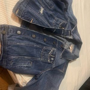 A cropped distressed jean jacket